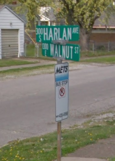 Walnut and Harlan Streets street sign